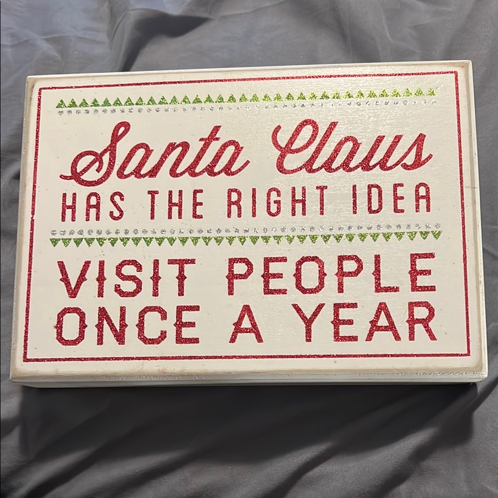 christmas sign Santa Claus has the right ideas visit people once a year